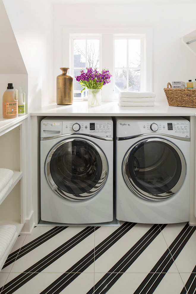 Laundry Room. Laundry Room Ideas. Laundry Room Flooring and Paint Color. The wall color was done in Sherwin Williams High Reflective White SW7757 and the porcelain 24 x 24 tile was purchased through Tile x Design. #LaundryRoom #LaundryRoomIdeas #LaundryRoomFloortiles #LaundryRoomflooring #LaundryRoomtiles #LaundryRoompaintcolor Martha O'Hara Interiors