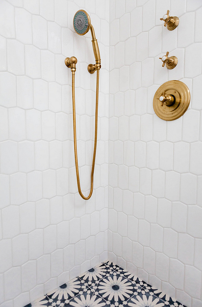 Brass Shower Faucet. Brass Shower Faucet Ideas. Brass Shower Faucet against white tiles and cement floor tiles. The shower brass faucets are from Newport Brass and the finish is Forever Brass. #BrassShowerFaucet