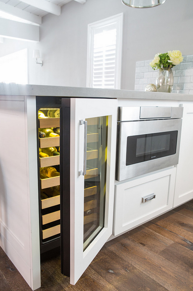 Kitchen Peninsula. Kitchen peninsula dimensions. The base cabinet width is actually 84" ( 18" wine ref, 24" mic drawer, and 42" pull out corner cabinet. The counter depth is 52 " and counter width is 96" due to a 12" overhang on both sides. Dannielle Albrecht Designs