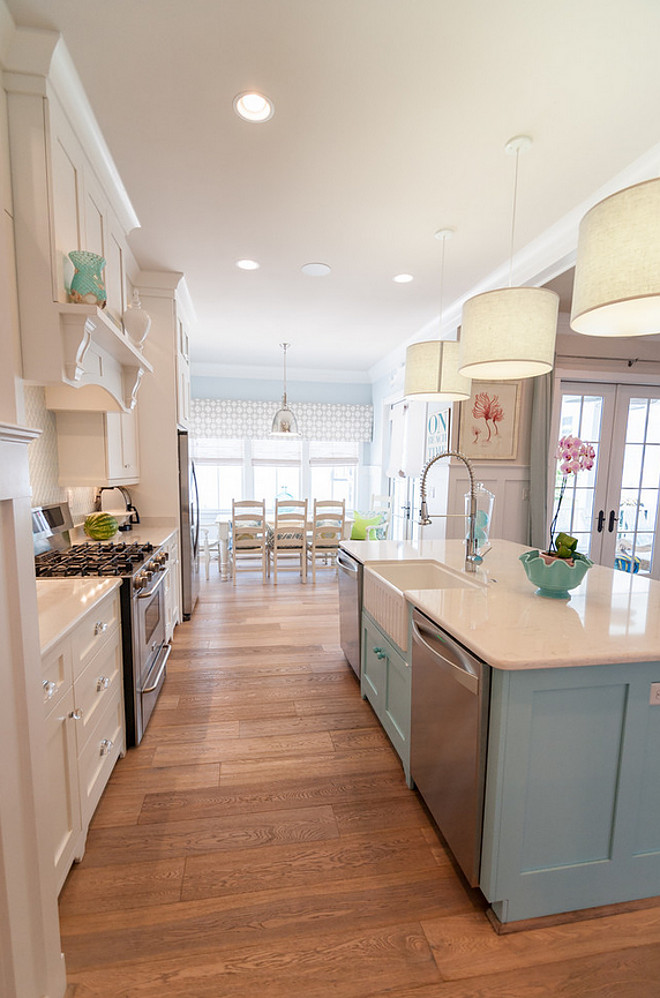 White kitchen with blue island paint color. Kitchen pendants are Jamie Young Custom Drum Pendant Lights. White perimeter kitchen with blue island paint color. Blue island paint color is Sherwin Williams Quench Blue. #Whitekitchen #Blueisland #WhitekitchenBlueisland #Paintcolor #SherwinWilliamsQuenchBlue