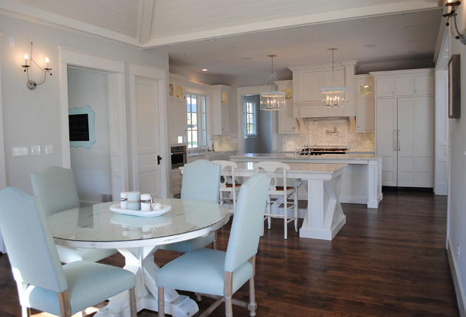 Kitchen features double islands. Wall sconces are by Low Country. Pendants over island are Urban Electric. Hardwood floors are hickory, wall color is Ben Moore HC Wickham Gray. Table is custom by Stacye Love Designs. #Kitchen #DoubleIsland #DoubleIslandkitchen 