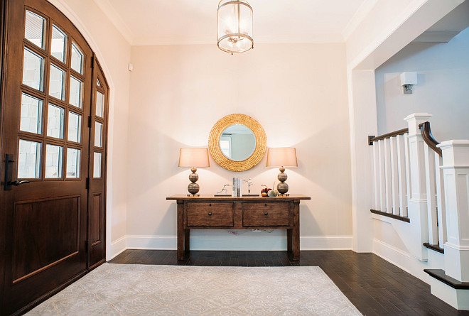 Foyer. Foyer Console Table, mirror, lamps, rug and decor. #Foyer #FoyerConsoleTable #FoyerMirror #FoyerRug #FoyerDecor Summit Signature Homes, Inc