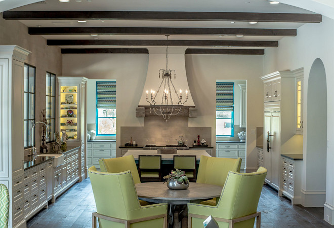 French Kitchen. Ivory French Kitchen with French chandelier and exposed ceiling beams. #FrenchKitchen #FrenchKitchen #FrenchChandelier #IvoryKitchen #Kitchen Platinum Series by Mark Molthan