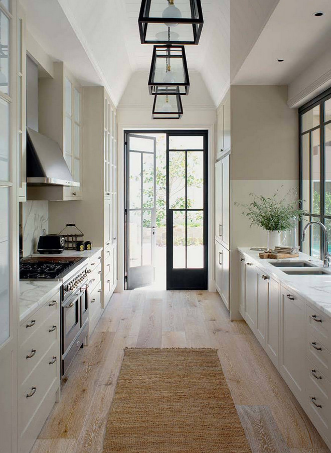 Kitchen. Galley Kitchen with wide plank floor and French doors to outside. Galley Kitchen. Woodstock Industries