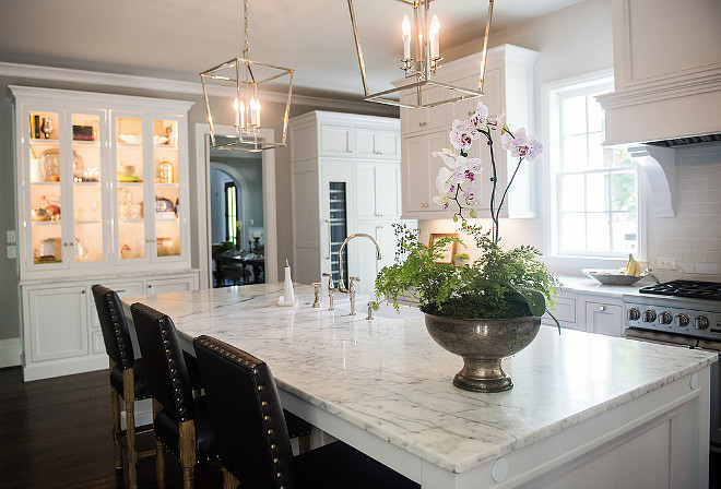 Marble island countertop. Classic white marble topping island in white kitchen. #Marblecountertop #islandmarblecountertop #whitemarble Artisan Design Studio