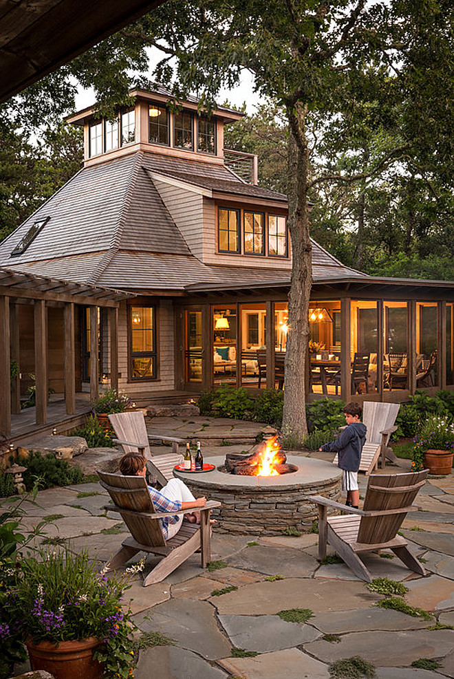 Stone firepit. Woodsy backyard with Stone firepit and stone patio. Stone firepit. Stone firepit ideas #Stonefirepit #Backyard Sullivan + Associates Architects