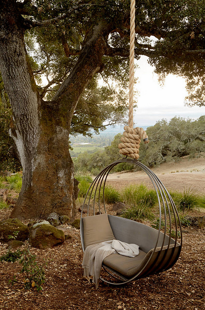Tree swing. Modern tree sing. Hanging chair on tree. Hanging chair is custom built by Erin Martin Design, St Helena. Ken Linsteadt Architects