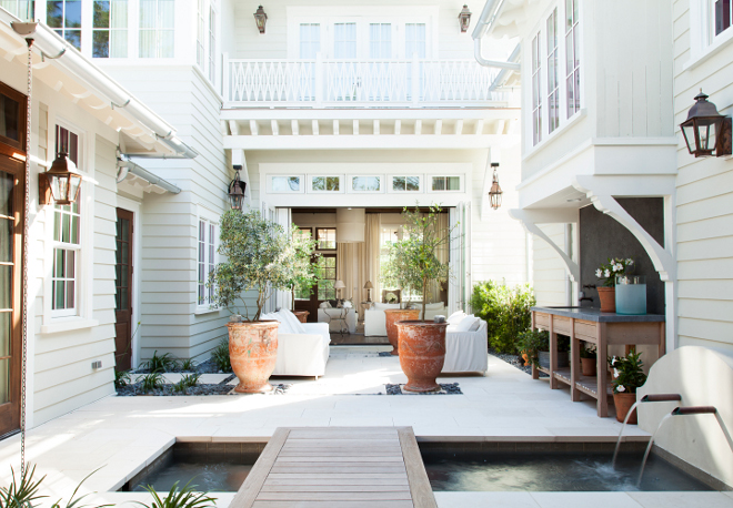 Backyard. Small Backyard. Small backyard design. This well-designed backyard features many inspiring details, such as a summer kitchen with brushed Imperial Gray Limestone countertop and backsplash. #ImperialGrayLimestone Interiors by Courtney Dickey of TS Adams Studio