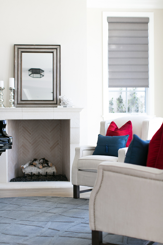 How to add color to neutral interiors. Pillows bring some color to this fairly neutral living room. Notice the beautiful limestone fireplace. #neutralinteriors #colorfulinteriors #addingcolor #Limestonefireplace Patterson Custom Homes. Brandon Architects, Inc.