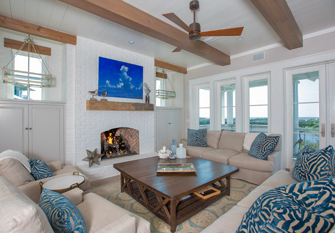 White brick fireplace. Painted White brick fireplace. Coastal living room with white brick fireplace. #Whitebrickfireplace #Whitebrickfireplaceideas #Whitebrickfireplacepaint #paintedWhitebrickfireplace T.S. Adams Studio, Architects