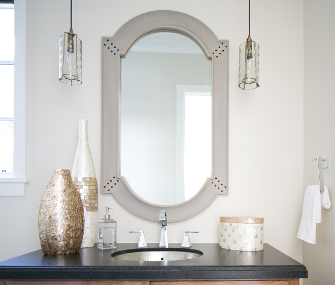 Powder room. Lighting is Arteriors Ice Small Pendants DK42050 - $420 each. Countertop is Absolute Black Granite. #powderroom #granite #blackgranite #lighting Patterson Custom Homes. Brandon Architects, Inc.