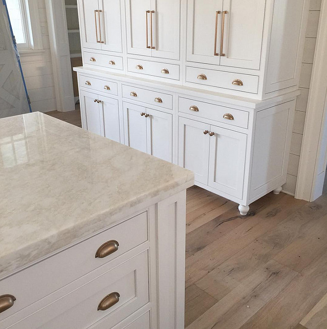 Kitchen. White inset cabinets with antique brass hardware and marble tops make for a great kitchen combination. Antique brass hardware is from Atlas Hardware. #kitchen #whitecabinets #insetcabinets #marblecountertop #antiquebrasshardware Artisan Signature Homes.