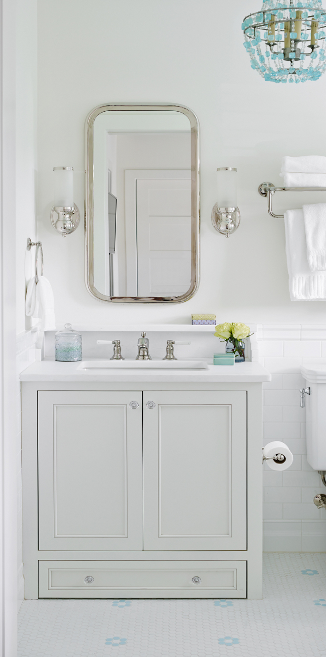 Bathroom with small vanity. This bathroom features a small vanity with glass knobs, white marble countertop and shelf. The vanity comes with a built-in step stool at the bottom. It's a step for one of the kids who couldn't quite reach the sink yet. Bathroom small vanity dimensions. Bathroom small vanity ideas. Bathroom small vanity decor. Bathroom small vanity design. Small vanity knobs. #Bathroomsmallvanity #Bathroom #Smallvanity #smallvanitydimension #smallvanityideas #smallvanitydesign #smallvanitybathroomideas #Bathroomsmallvanityknobs T.S. Adams Studio, Architects