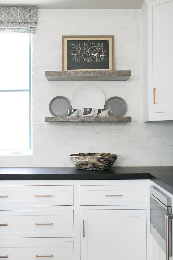 Brick backsplash. White brick backsplash. White brick backsplash gives a great texture to white kitchens. This is a mason brick that was applied to the surface of the wall. The paint color is Dunn Edwards Spartawall White Flat White. #whitebrickbacksplash #backsplash #brickbacksplash Patterson Custom Homes