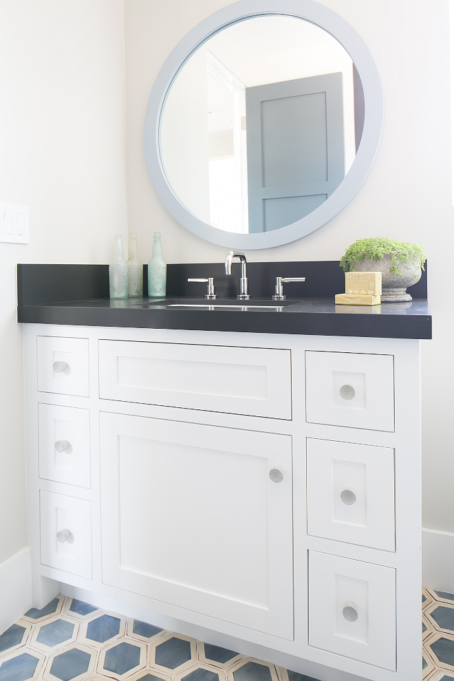 The handmade blue hex floor tile, against a crisp white vanity with a dark granite countertop & a blue painted mirror all add color and contrast making this bathroom unforgettable. The handmade blue hex floor tile, against a crisp white vanity with a dark granite countertop & a blue painted mirror all add color and contrast making this bathroom unforgettable. Patterson Custom Homes