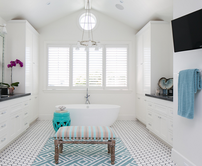 Bathroom lighting and flooring. Lighting is Jonathan Adler's Havana 6 Light Chandelier (Model W709), Powder Coat Shade - $796.95 Flooring is 4" White Thasos with 1/4" Bardiglio border. Patterson Custom Homes. Brandon Architects, Inc.