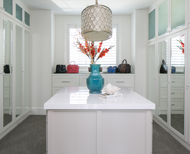 Beautiful closet with mirrored door cabinets. This closet is roughly 14' x 14'. Lighting: Feiss 3-Light Lucia Oval Chandelier, Burnished Silver #closet Patterson Custom Homes. Brandon Architects, Inc.