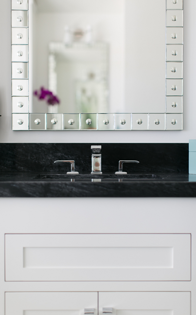 Beautiful white cabinets contrast with black countertop. Black marble countertop is Bardiglio Marble. Patterson Custom Homes. Brandon Architects, Inc.