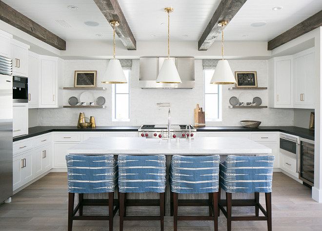 Kitchen reclaimed wood ceiling beams. Kitchen reclaimed ceiling beams. The beams are reclaimed box beams made out of grey barn wood with 5" wide channel board planks, supplied by the builder's local finish carpenter. #kitchen #reclaimedbeams #reclaimedwoodbeams #reclaimedwoodceiling Patterson Custom Homes