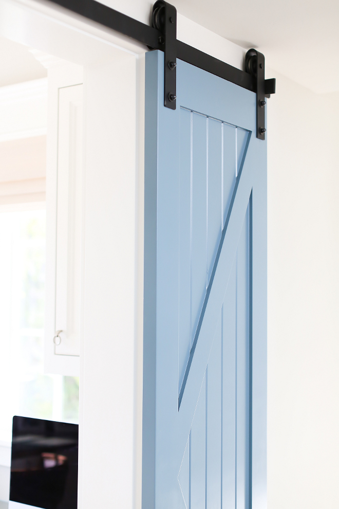 The barn door is painted in a soft blue color. barn door hardware. barn doors. barn door hardware. barn doors. barn door hardware. barn doors. barn door hardware. barn doors Patterson Custom Homes. Interiors by Trish Steele, Churchill Design. 