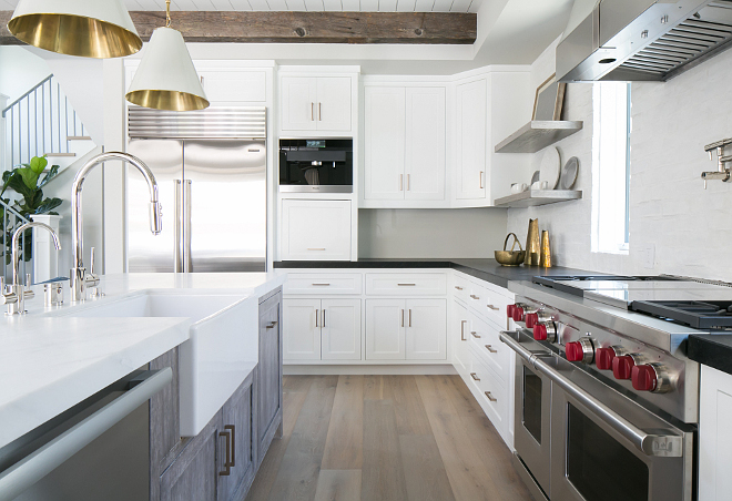 Kitchen Range. Range is a Wolf 48" Dual Fuel Range - 4 Burners and French Top. Notice the beautiful graywash stain used on the kitchen island. #kitchen #kitchenrange #island #floor #lighting #kitchens Patterson Custom Homes 