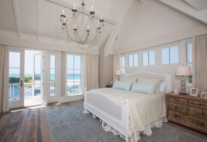 Beach House master bedroom. Master bedroom. Neutral beach house master bedroom with ivory decor and vaulted ceiling. #Masterbedroom #Beachousebedroom #ivorybedroom #vaultedceiling #neutralbedroom #neutralbeachinteriors #neutralcoastalinteriors #interiors T.S. Adams Studio, Architects