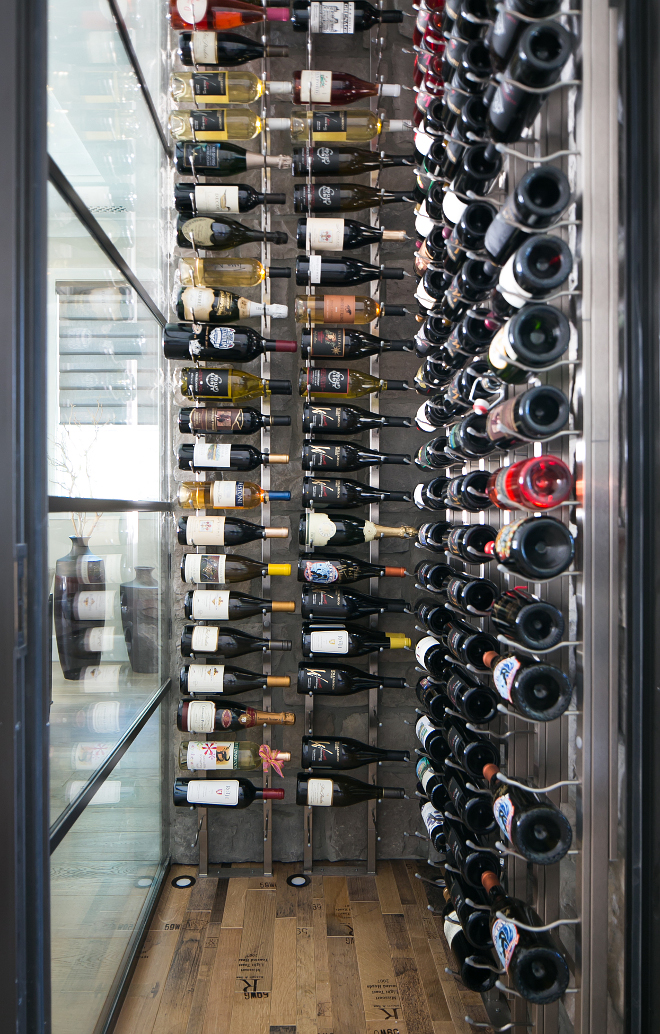 Reclaimed wine barrel wood floors. This glass wine cellar features reclaimed wine barrel wood floors. #glasswinecellar #Reclaimedwinebarrelwoodfloors #Reclaimedwinebarrelfloors Patterson Custom Homes. Brandon Architects, Inc.