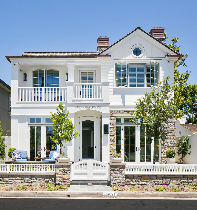 The exterior paint is Dunn Edwards' White DEW380, with the front door painted in Dunn Edwards' Ash Grey DEC751. Patterson Custom Homes. Brandon Architects, Inc.