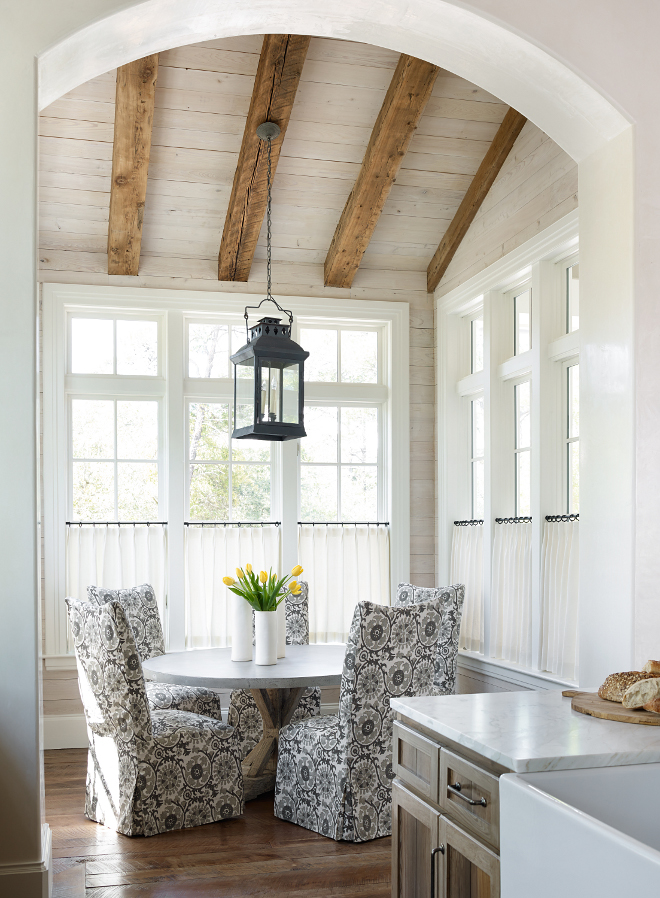Beams in dining room are heart of pine. Dining table is a concrete table top with reclaimed elm base. Stunning! Dining chairs are from Lee Industries. Lighting was provided by owner.