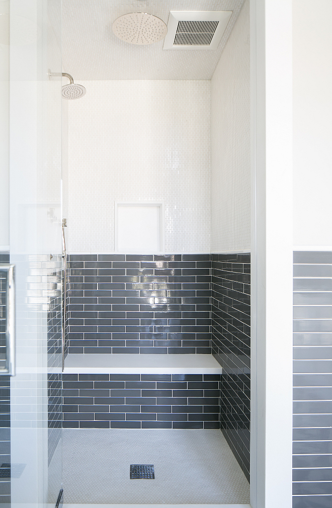 Shower Tiles. Bathroom shower tiling. Shower tiling. The shower features upper walls clad in white mosaic tiles and lower walls clad in charcoal gray brick tiles lined with a white floating shower bench hovering over a white mosaic tiled shower floor. Master Bath- Shower walls: 2”x10” Piastrella Grigio with ¾”x12” Thasos. Chelsea molding. #showertiles #showertiling #shower #tile Patterson Custom Homes