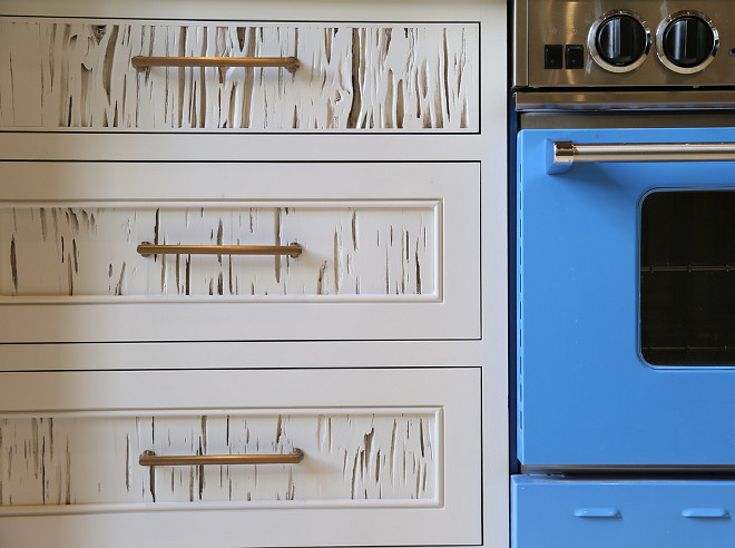 Rustic White Kitchen. This rustic white kitchen features pecky cypress cabinets painted in white. #Peckycypress #rusticwhitekitchen #rustickitchen #rusticwhitekitchencabinet #rustickitchencabinet Old Seagrove Homes.