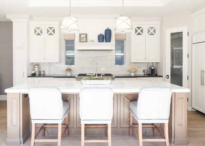 Kitchen. This kitchen is so beautiful! I love the white oak kitchen island, the E.F. Chapman Grosvenor 2 Light Hanging Shade pendants and the subtle decor. #kitchen #kitchenlighting #kitchendecor #kitchenpendants Patterson Custom Homes. Interiors by Trish Steele, Churchill Design.