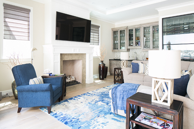 Empty Nester Home Ideas. This is the ultimate family room for empty nesters! The kitchen opens directly to a cozy family room with wet bar and custom glass wine cellar. #EmptyNesterHome #EmptyNesterHomeIdeas #wetbar #glasswinecellar Patterson Custom Homes. Brandon Architects, Inc.