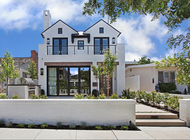 Exterior Ideas: Exterior paint color is Dunn Edwards Whisper White. The exterior is white smooth trowel plaster and white brick. Lanterns are " E.F. Chapman 2 Light Outdoor Wall Lantern in Bronze (CHO2910BZ)". Roof is Black Aluminum Standing Seam Roof— Maintenance free: will not rust, crack, or rot… Resists streaking and staining… Never needs cleaning. Gutters are black aluminum to match standing seam roof. #Exteriors #Homeexterior #exteriorideas #Brickexterior #Exteriorpaintcolor #DunnEdwardsWhisperWhite Patterson Custom Homes