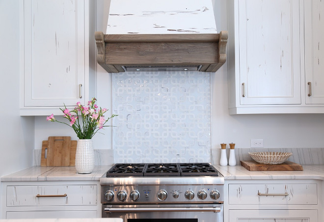 Reclaimed kitchen cabinet and hood. Reclaimed kitchen cabinet and hood ideas. Reclaimed kitchen cabinets are pecky cypress and hood features cypress wood. #reclaimedkitchen #reclaimedkitchencabinet #reclaimedhood #kitchen #preckycypress #cypresscabinet Old Seagrove Homes.