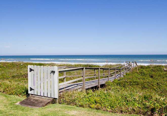 Beach dock with gate to keep it private. A gate adds a sense of privacy to this dock and to the property. Heritage Homes of Jacksonville. Villa Decor & Design.