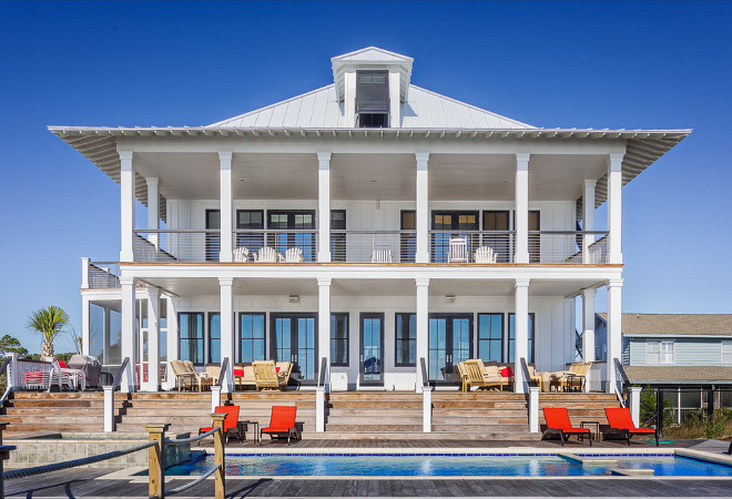 Beach house windows and doors. This beach house windows and doors are impact rated unit manufactured by EAGLE (black) Catalyst Architects, LLC