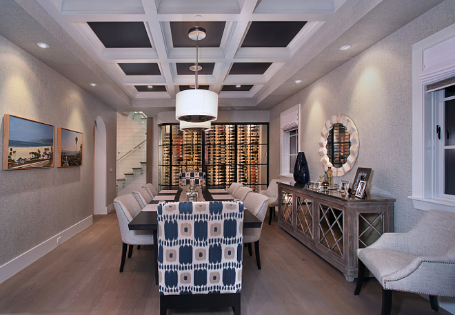 Dining Room. I am very impressed by this dining room. I love the painted coffered ceiling, the wine cellar and the neutral wallpaper. #diningroom #paintedcofferedceiling #Cofferedceiling #neutralwallpaper #wallpaper #winecellar #diningrooms Patterson Custom Homes. Interiors by Trish Steele of Churchill Design. 