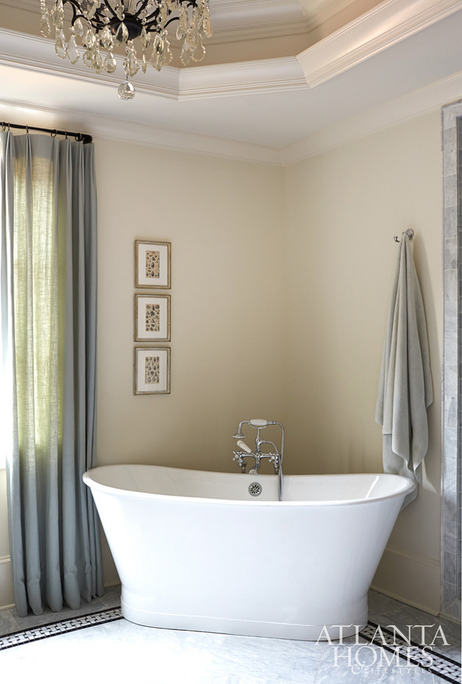 Freestanding bath in the corner. Corner bath tub. Corner freestanding bath. A skirted tub by Sunrise Specialty is placed in the corner of the master bath so as not to take up additional real estate in the room. 