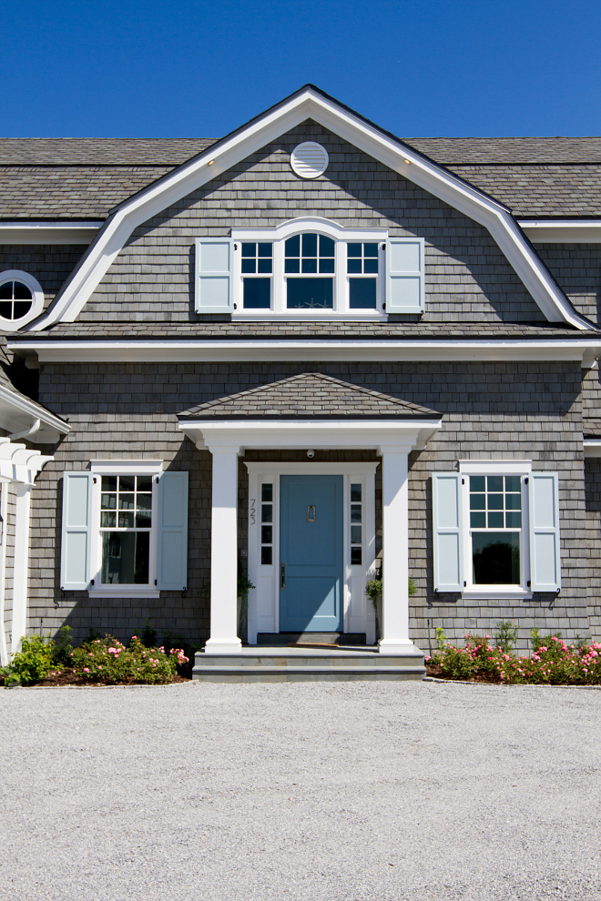 The siding of this Hamptons style shingle home is cedar shake painted. Shutters are Timberlane and windows are PGT. Heritage Homes of Jacksonville and Villa Decor & Design