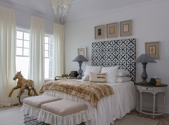 Ivory and Navy blue bedroom. Gorgeous ivory and navy bedroom with painted tongue and groove ceiling. Ceiling paint color is "Benjamin Moore Decorator's White". #bedroom #ivorybedroom #ivorywhite #BenjaminMooreDecoratorsWhite