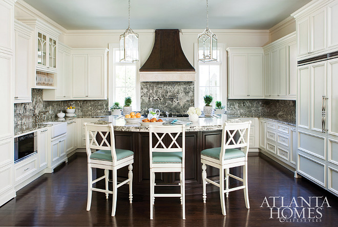 Kitchen ivory cabinets with dark hardwood floors and blue ceiling painted in Rhine River by Benjamin Moore. Mallory Mathison Inc.. Atlanta Homes & Lifestyles.