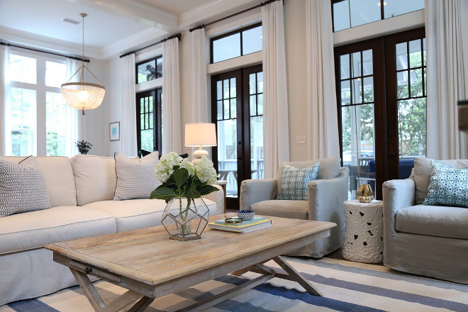 Living room furniture, rug and chairs. Beuatiful slipcovered sofa and whitewashed coffee table are from Beau Interiors in Grayton Beach, Florida. #livingroom #furniture Old Seagrove Homes.