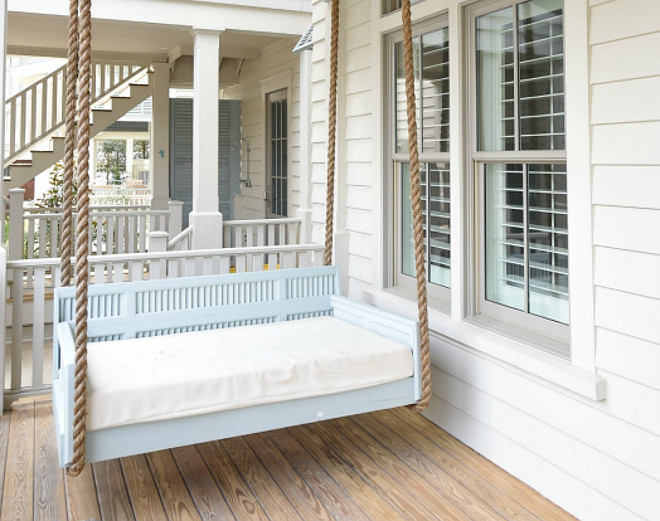 Porch Swing. Blue porch swing painted in Benjamin Moore Kentucky Haze. Porch swing with rope. Coastal porch swing with rope and painted in a blue paint color, Benjamin Moore Kentucky Haze.Interiors by Courtney Dickey of TS Adams Studio. 