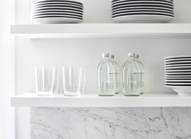 White Floating kitchen shelves. The designer chose to use open shelves to the right of the window to further open up the space. #kitchen #openshelves #shelves #floatingshelves Elizabeth Lawson Design