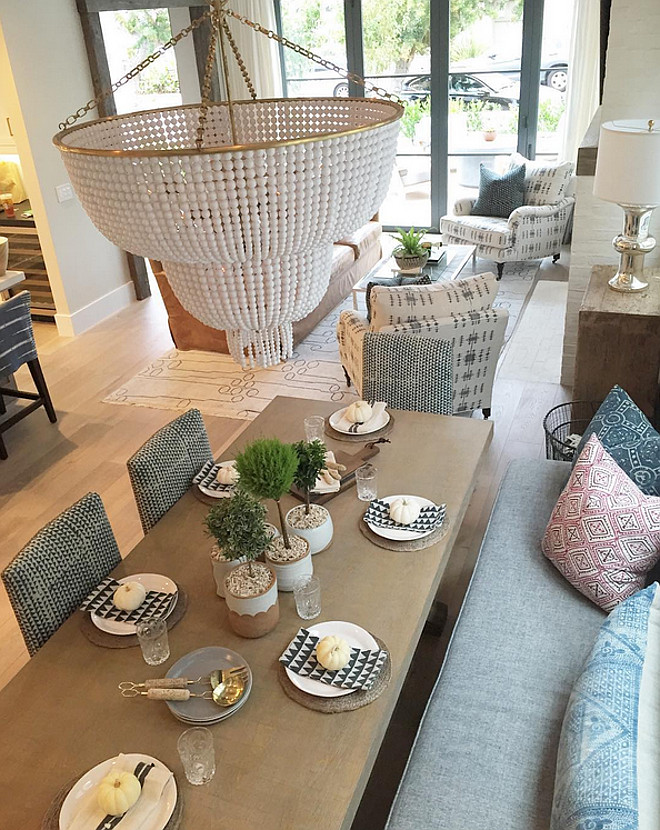 Dining room banquette. Long tables are the best! I also love how comfy this custom banquette looks! Topiaries are from Molly Wood Garden Landscape Design. #diningroom #banquette #topiaries Patterson Custom Homes