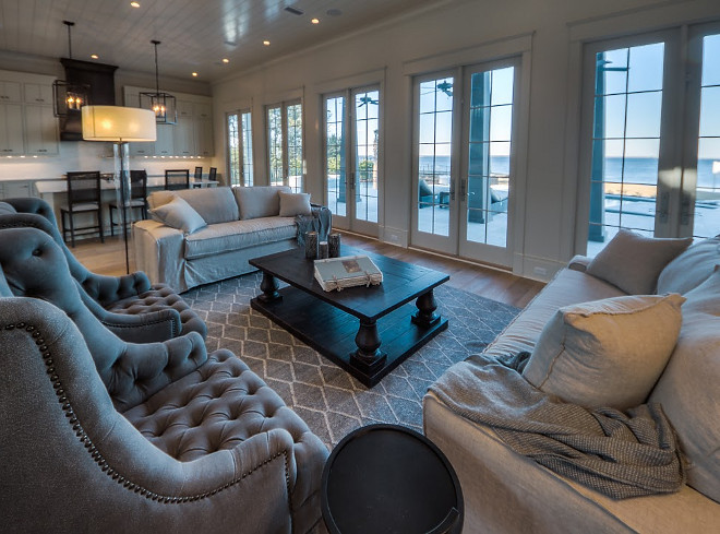 Kitchen and Living wall of French doors. French doors are used on an entire wall to make the space feel connected to the outdoors. #FrenchDoors #Wallofdoors #Kitchen #Livingroom #Kitchendoors #Livingroomdoors Casey Joiner