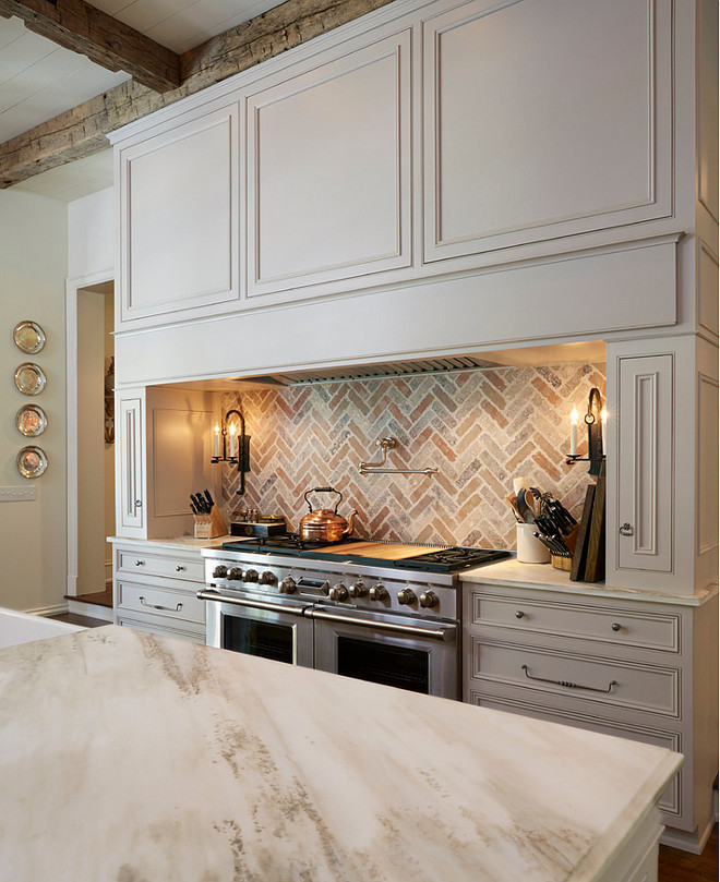 Off White Kitchen With Brick Backsplash