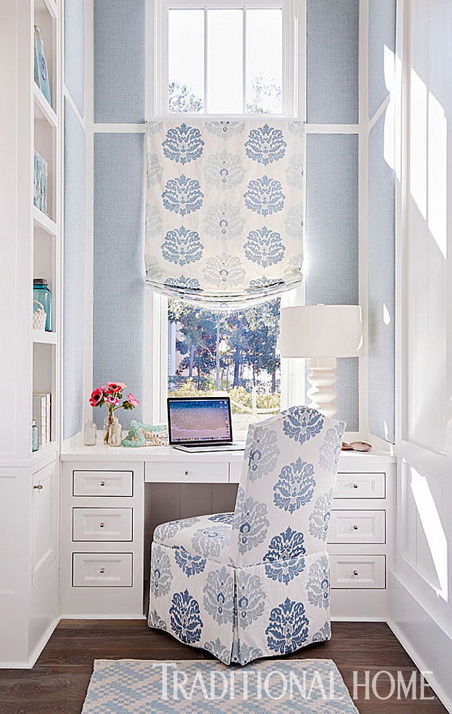 Home Office. Small Home Office. Upholstered wall panels soften this compact office. A Jane Churchill fabric in shades of blue and white dresses the window and desk chair. Trim and cabinet paint color is “Decorator’s White” OC-149 by Benjamin Moore. #HomeOffice #office #Romanshades #fabric #chair