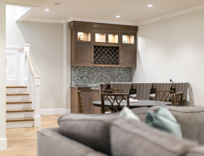 Basement Bar. Bar. Basement features bar area in stained white oak, caesarstone countertop and glass backsplash. #Bar #Basement #ideas Churchill Design